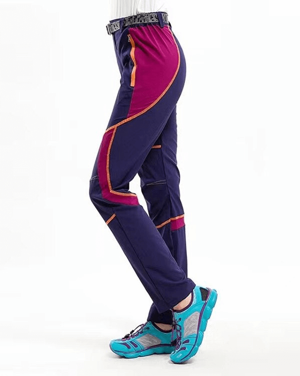 Sports Breathable Quick-Drying Women's Hiking Pants in purple with blue sneakers, side view
